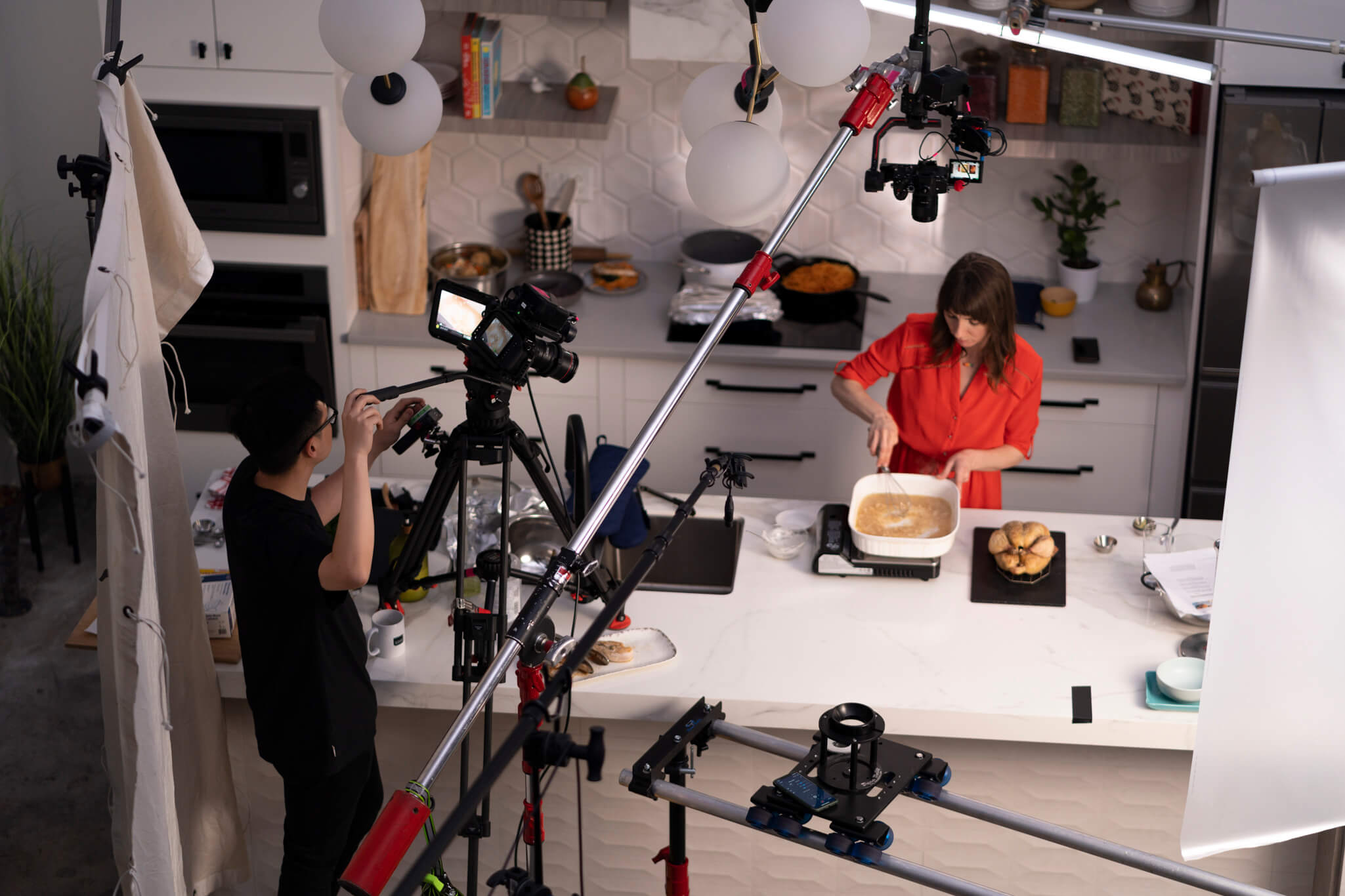 Crew filming a recipe video in a studio kitchen