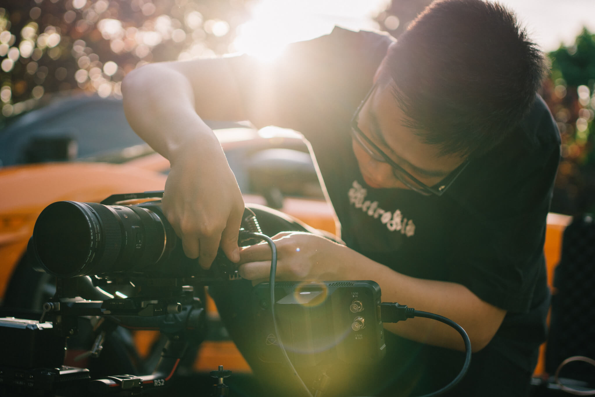 Camera assistant preparing a cinema lens