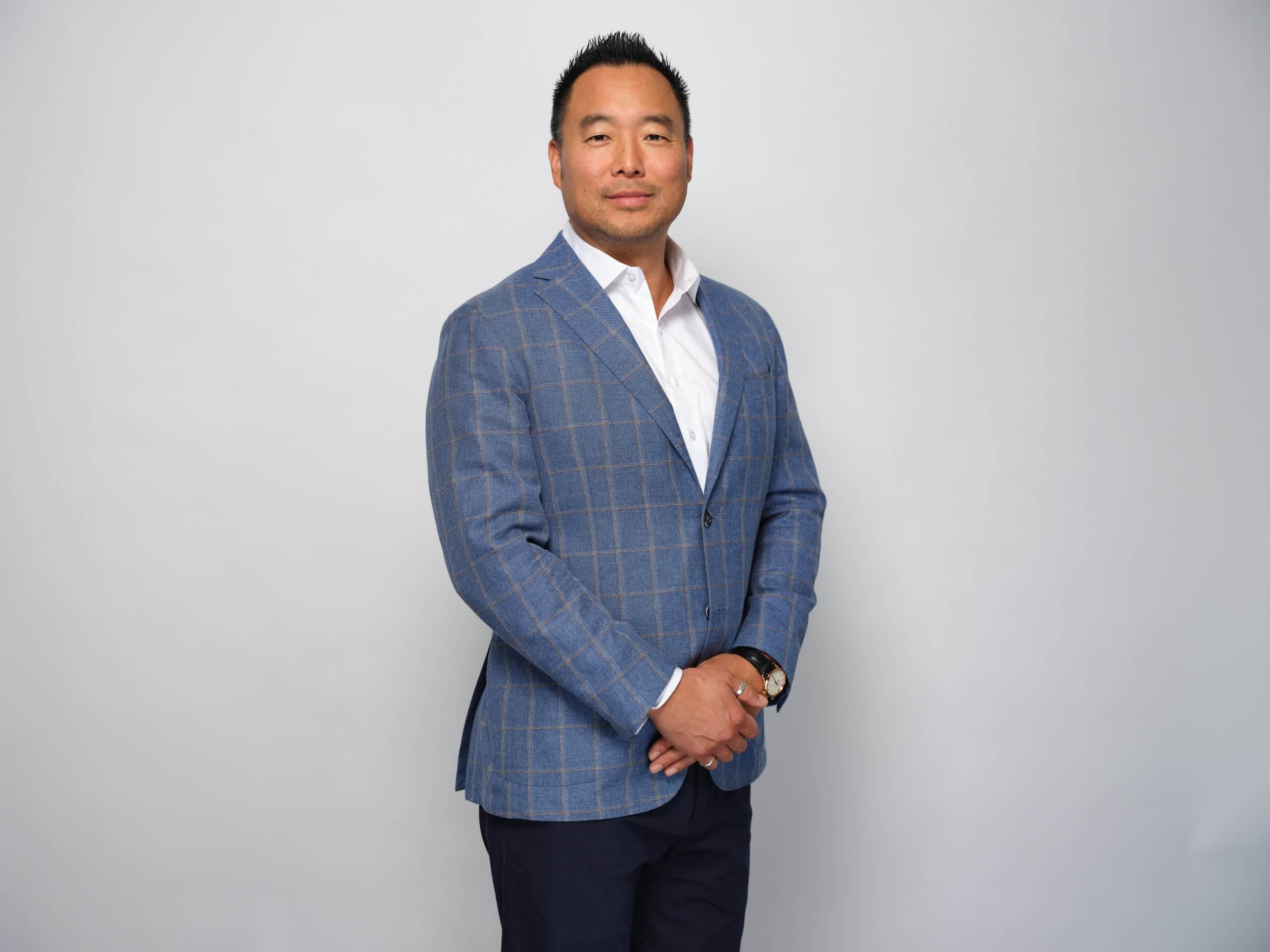 Corporate portrait of a man in a blue blazer