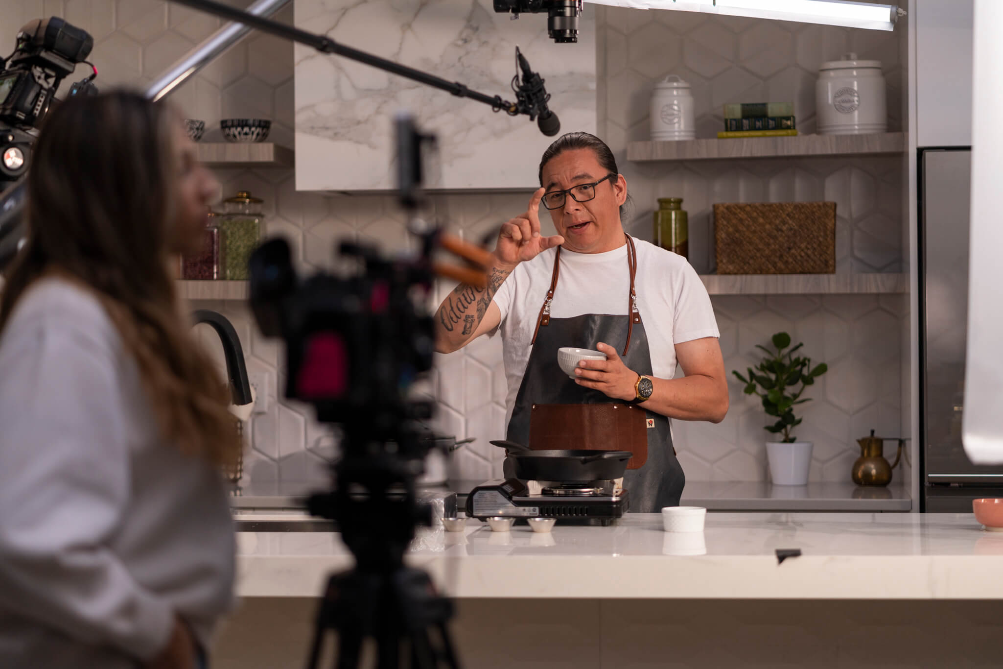 Chef cooking on set during a Chicken Farmers of Canada shoot