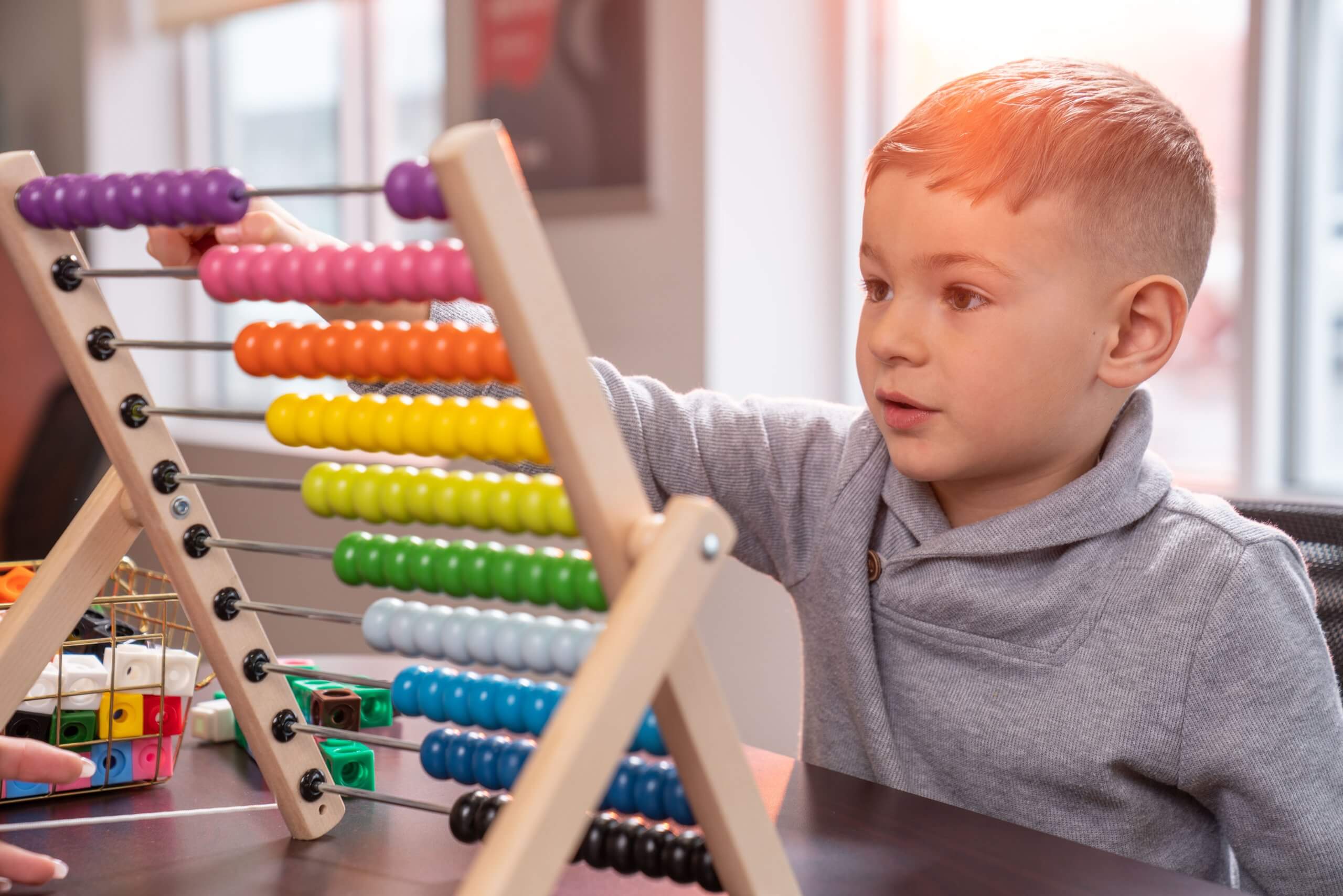 Child playing with an abacus